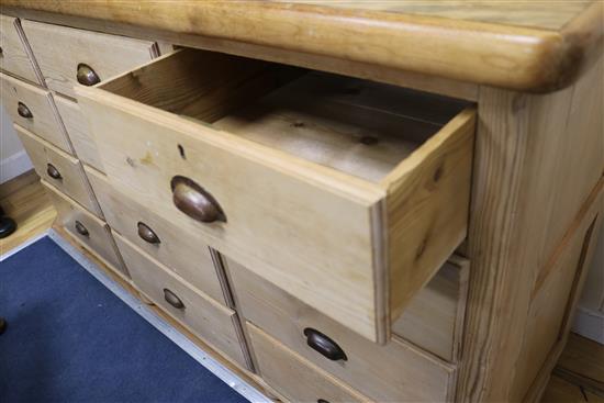 A pine chest of twelve drawers W.165cm